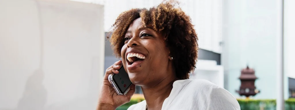 Happy lady talking on the phone.